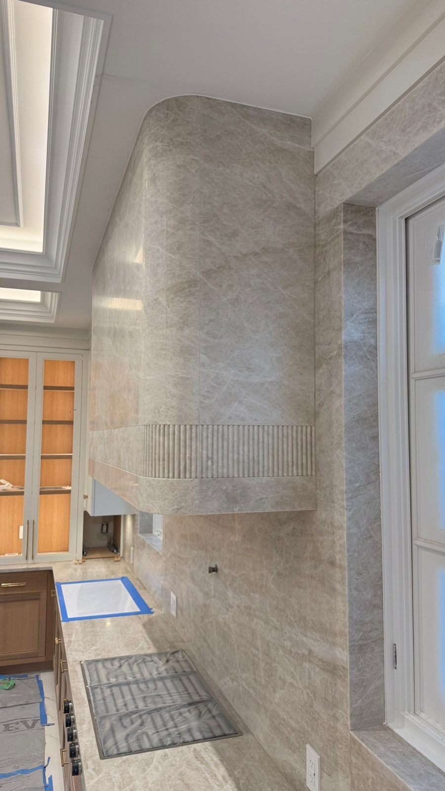 Taj Mahal quartzite range hood by Fine Stone Works