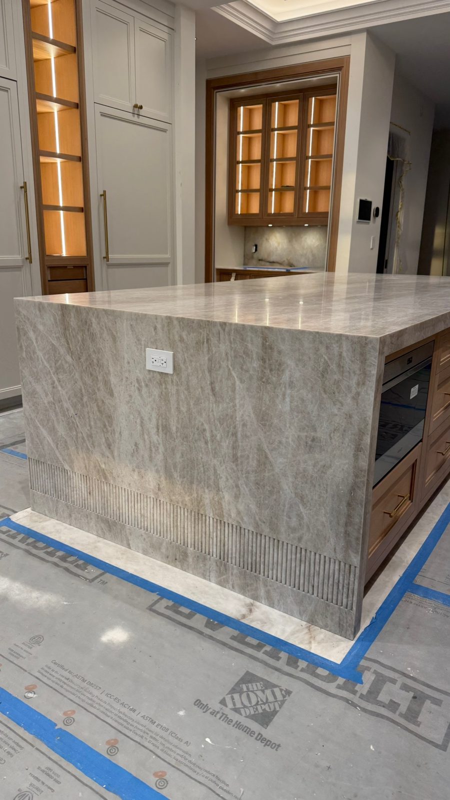 Taj Mahal quartzite waterfall island by Fine Stone Works