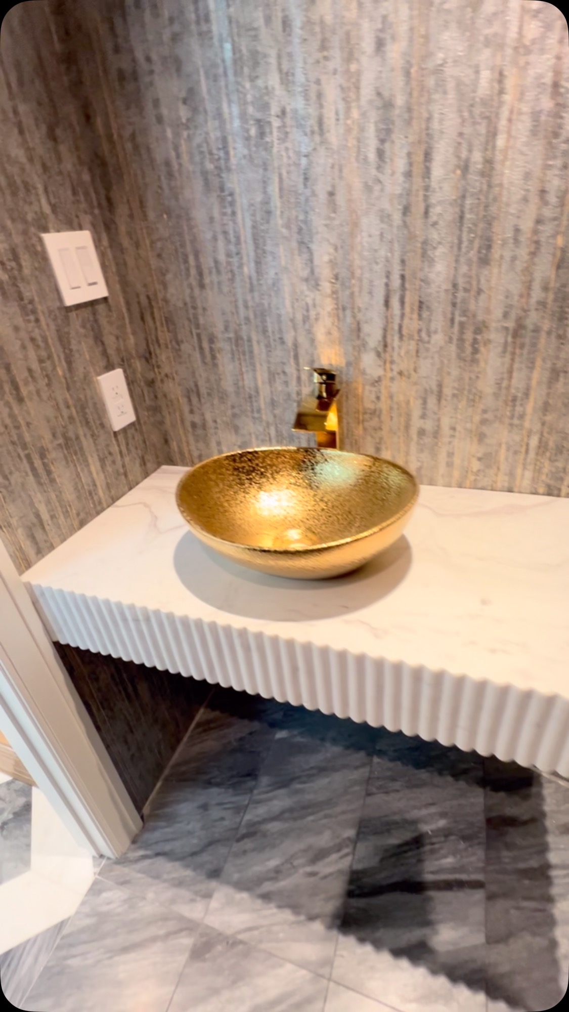 Vanity with custom fluted apron by Fine Stone Works